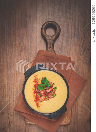 pumpkin cream soup with shrimp, herbs and spices, homemade, no people, 129996269