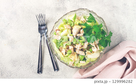 Waldorf salad, celery salad with apple, in a glass salad bowl, natural light, homemade, no people, Waldorf salad, celery salad with apple, in a glass salad bowl, natural light, homemade, no people, 129996282