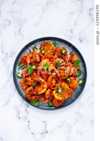 grilled shrimp, unpeeled, headless, with spices, on a marble table, homemade, no people, grilled shrimp, unpeeled, headless, with spices, on a marble table, homemade, no people, 129996299