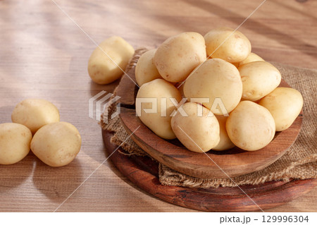 boiled new potatoes, in a wooden bowl, on a rustic table, natural light, no people, boiled new potatoes, in a wooden bowl, on a rustic table, natural light, no people, 129996304