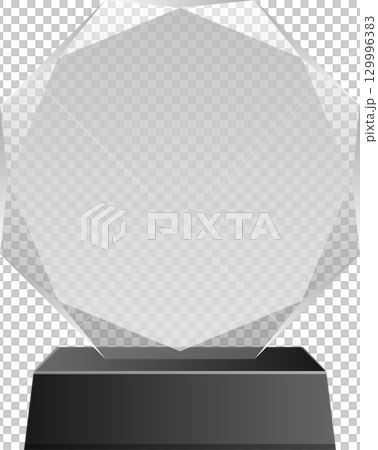A multifaceted clear award sits on a square, dark grey base on a black background. Minimalist. 129996383