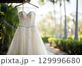 beautiful wedding dress hanging on the hanger 129996680