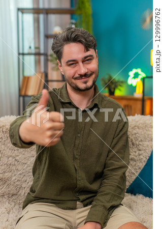 Middle-aged man thumbs up smiling showing positive ok feedback happy approval gesture satisfied like Middle-aged man thumbs up smiling showing positive ok feedback happy approval gesture satisfied like 129996762