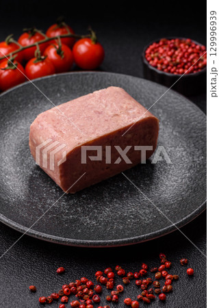Food, meat, ham sliced in slices for the festive table. Spiced ham Food, meat, ham sliced in slices for the festive table. Spiced ham 129996939