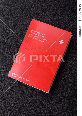 Swiss passport for travelling, flying and doing business. Switzerland document Swiss passport for travelling, flying and doing business. Switzerland document 129997049