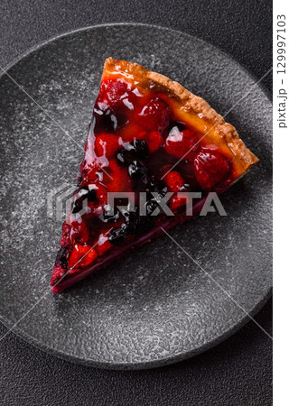 Pie, cheesecake with mascarpone, raspberries and blackberries. Cheesecake with cheese Pie, cheesecake with mascarpone, raspberries and blackberries. Cheesecake with cheese 129997103