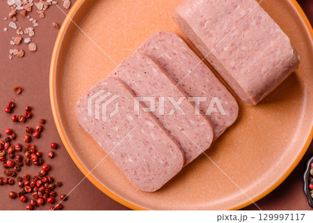 Food, meat, ham sliced in slices for the festive table. Spiced ham 129997117