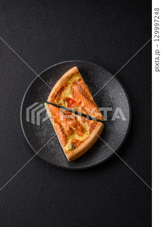 Quiche, salmon pie, broccoli, cheese. Quiche tart with fish and vegetables, cheese 129997248