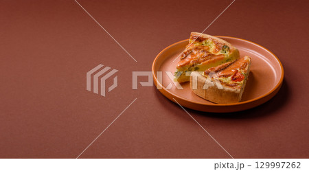 Quiche, salmon pie, broccoli, cheese. Quiche tart with fish and vegetables, cheese 129997262