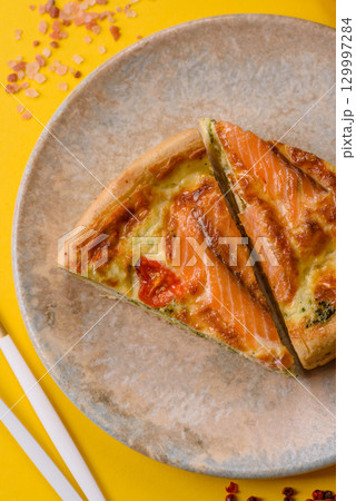 Quiche, salmon pie, broccoli, cheese. Quiche tart with fish and vegetables, cheese 129997284