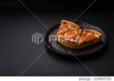 Quiche, salmon pie, broccoli, cheese. Quiche tart with fish and vegetables, cheese 129997310