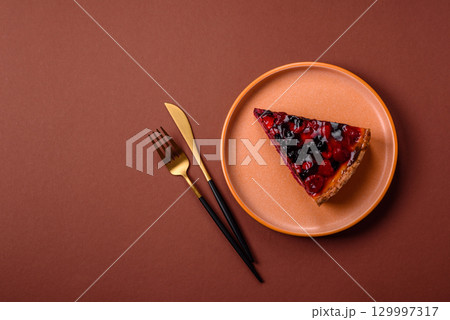 Pie, cheesecake with mascarpone, raspberries and blackberries. Cheesecake with cheese 129997317