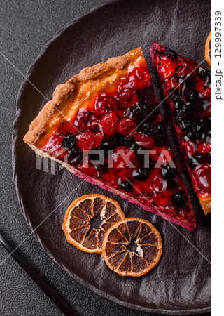 Pie, cheesecake with mascarpone, raspberries and blackberries. Cheesecake with cheese 129997339