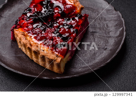 Pie, cheesecake with mascarpone, raspberries and blackberries. Cheesecake with cheese 129997341