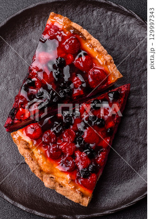 Pie, cheesecake with mascarpone, raspberries and blackberries. Cheesecake with cheese Pie, cheesecake with mascarpone, raspberries and blackberries. Cheesecake with cheese 129997343