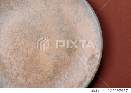 Empty round black plate for food, kitchen utensils on dining table. Empty plate Empty round black plate for food, kitchen utensils on dining table. Empty plate 129997487