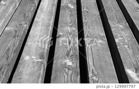 Monochrome texture of wooden boards. Perspective view 129997797