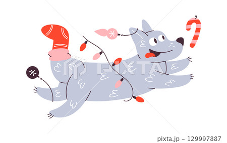 Christmas dog chasing candy cane Christmas dog chasing candy cane 129997887