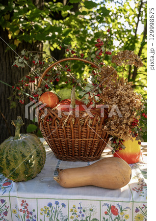 A vase filled with flowers sitting on a table 129998675