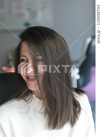 elegant woman over 40, business lady, works in the office elegant woman over 40, business lady, works in the office 129998793