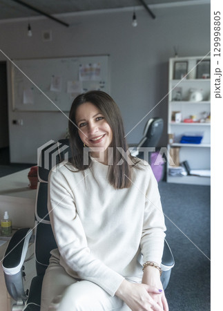 elegant woman over 40, business lady, works in the office 129998805