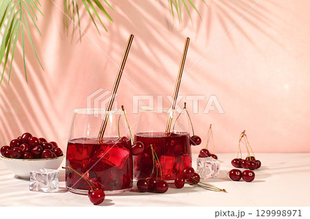 Refreshing homemade lemonade cocktail,mojito with cherry, mint, ice and lemon, weight loss concept, detox water with fruit flavor. Healthy and natural food, advertising for bar and cafe,autumn banner 129998971