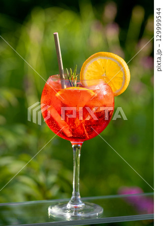 glass of classic red spritz cocktail 129999544