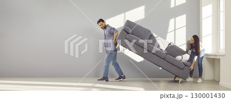 Banner with happy young family couple moving furniture in new house or apartment Banner with happy young family couple moving furniture in new house or apartment 130001430