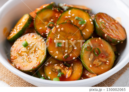 Korean cucumber salad (Oi muchim) in bowl, Korean side dish Korean cucumber salad (Oi muchim) in bowl, Korean side dish 130002065