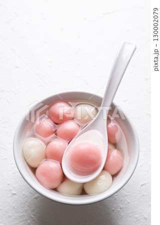 Tangyuan (Chinese sweet dumpling), Glutinous rice ball in syrup, Dessert celebrated in mid autumn lantern festival or new year Tangyuan (Chinese sweet dumpling), Glutinous rice ball in syrup, Dessert celebrated in mid autumn lantern festival or new year 130002079
