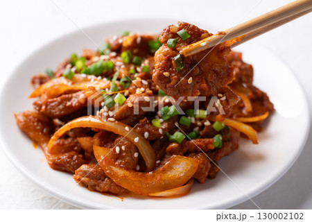 Korean stir fried spicy pork (Bulgogi) with chopsticks 130002102