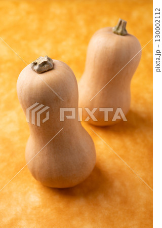 Fresh butternut squash pumpkin on orange background, Vegetable in Autumn season, Food ingredient 130002112