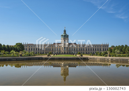 Berlin, Germany - July 19, 2022 : back side at Charlottenburg Palace (Schloss) the Baroque summer palace with garden Berlin, Germany - July 19, 2022 : back side at Charlottenburg Palace (Schloss) the Baroque summer palace with garden 130002743