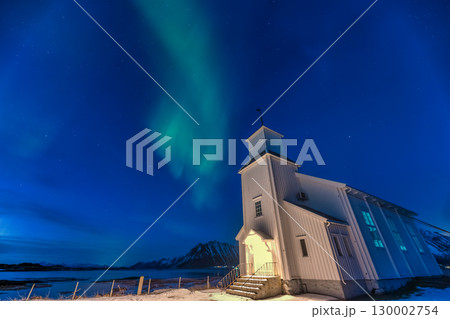 Lofoten Norway, aurora borealis northern lights winter landscape at Gimsoysand church 130002754