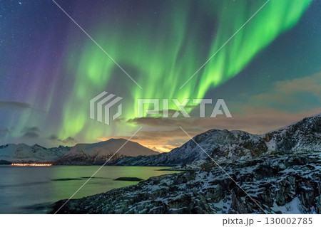 Tromso Norway, aurora borealis northern lights winter landscape at Rorvikneset Sommaroy Tromso Norway, aurora borealis northern lights winter landscape at Rorvikneset Sommaroy 130002785