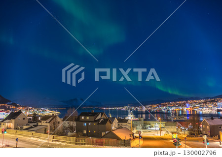 Tromso Norway, aurora borealis northern lights winter landscape at Tromsdalstinden Tromso Norway, aurora borealis northern lights winter landscape at Tromsdalstinden 130002796
