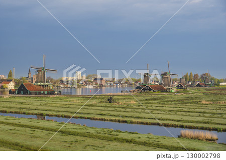 Dutch Windmill and traditional house at Zaanse Schans Village, Amsterdam Netherlands 130002798