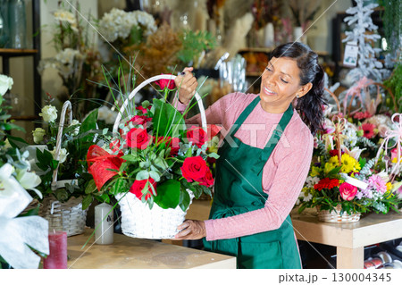 Latin woman florist in flower shop Latin woman florist in flower shop 130004345
