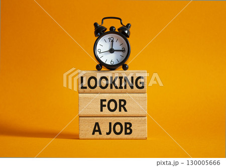 Looking for a job symbol. Concept words Looking for a job on wooden blocks. Beautiful orange background with alarm clock. Business and Looking for a job concept. Copy space. Looking for a job symbol. Concept words Looking for a job on wooden blocks. Beautiful orange background with alarm clock. Business and Looking for a job concept. Copy space. 130005666