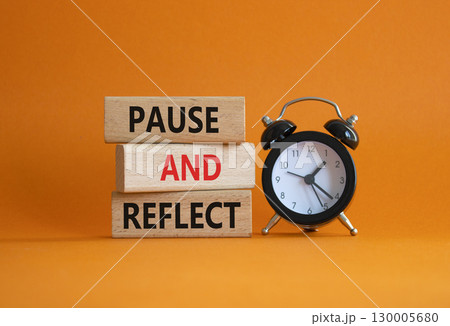 Pause and Reflect symbol. Concept words Pause and Reflect on wooden blocks. Beautiful orange background with alarm clock. Business and Pause and Reflect concept. Copy space. Pause and Reflect symbol. Concept words Pause and Reflect on wooden blocks. Beautiful orange background with alarm clock. Business and Pause and Reflect concept. Copy space. 130005680