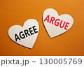 Agree or Argue symbol. Concept word Agree or Argue on wooden hearts. Beautiful orange background. Business and Agree or Argue concept. Copy space 130005769