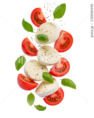 Fresh mozzarella slices, tomato quarters and basil leaves with pepper isolated on white background, caprese salad concept 130006449