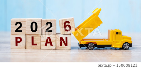2026 Plan cube blocks with miniature truck or construction vehicle. New Start, Vision, Resolution, goal, industrial, Warehouse and happy New Year concept 130008123