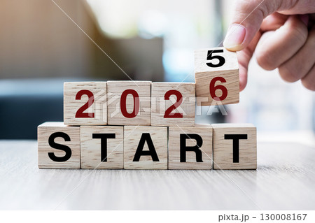 Businessman hand holding wooden cube with flip over block 2025 to 2026 Plans word on table background. Resolution, strategy, solution, goal, business and New Year holiday concepts Businessman hand holding wooden cube with flip over block 2025 to 2026 Plans word on table background. Resolution, strategy, solution, goal, business and New Year holiday concepts 130008167