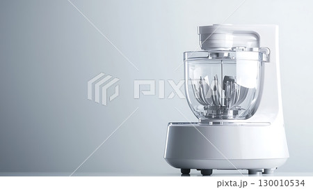 A white food processor sits on a countertop 130010534