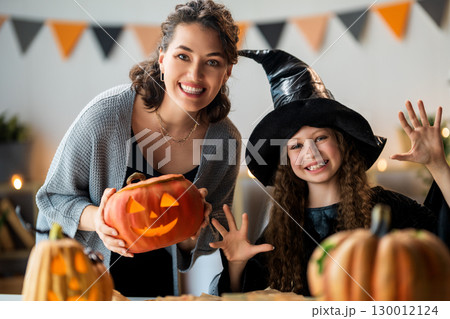 Happy family preparing for Halloween. Happy family preparing for Halloween. 130012124