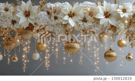Elegant white and gold floral garland with sparkling ornaments and lights creates festive and luxurious holiday atmosphere 130012819