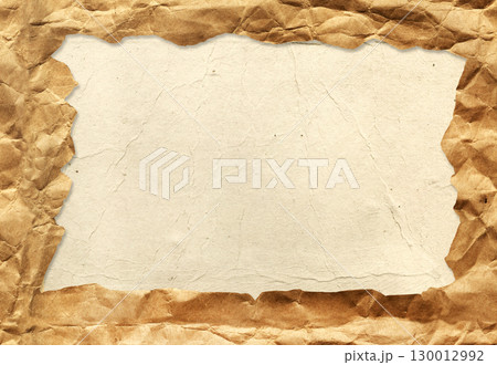 Horizontal or vertical background with torn paper edge. Cardboard texture of yellow color and crumpled paper of light brown color. Copy space for text 130012992