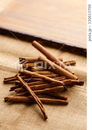 Cinnamon sticks dried tree bark spice on rustic background. Cinnamon sticks dried tree bark spice on rustic background. 130013709