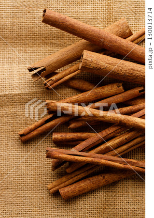 Cinnamon sticks dried tree bark spice on rustic background. Cinnamon sticks dried tree bark spice on rustic background. 130013714